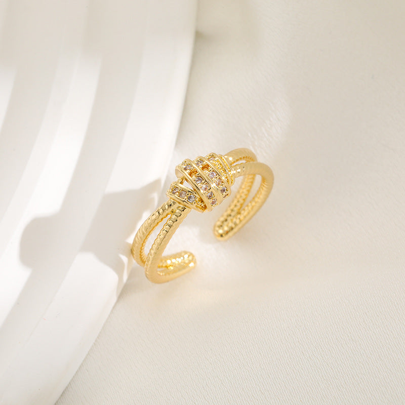 Ladies ring with elaborate, multi-layered design and zirconia appliqués Nin Boutique