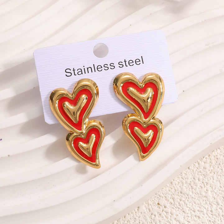 Ladies earrings in playful heart design Nin Boutique