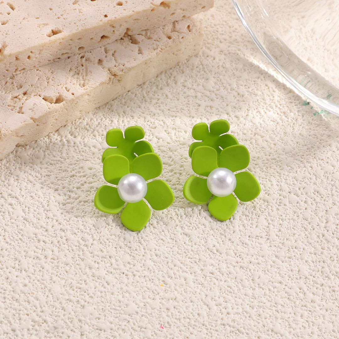 Ladies earrings in artistic floral style with pearl accent Nin Boutique