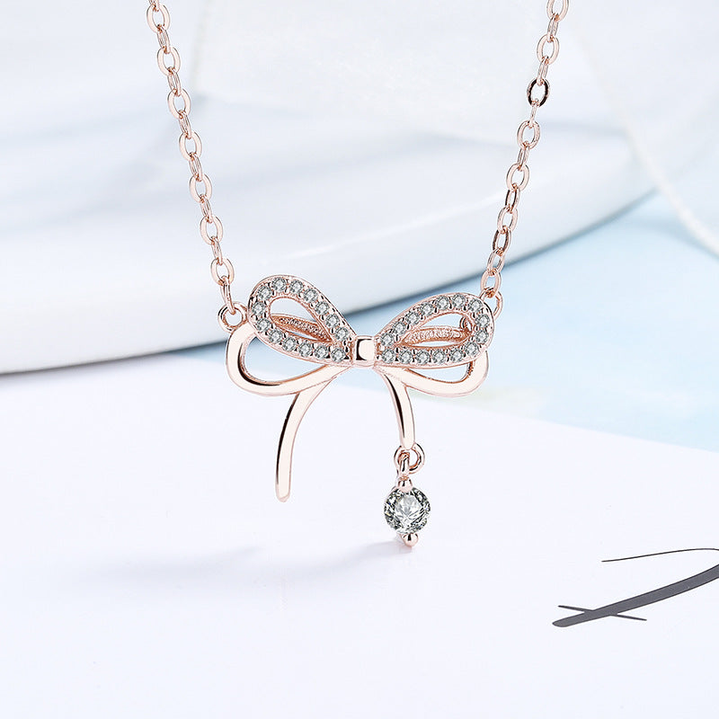 Women's necklace with intricate bow pendant and sparkling zirconia Nin Boutique