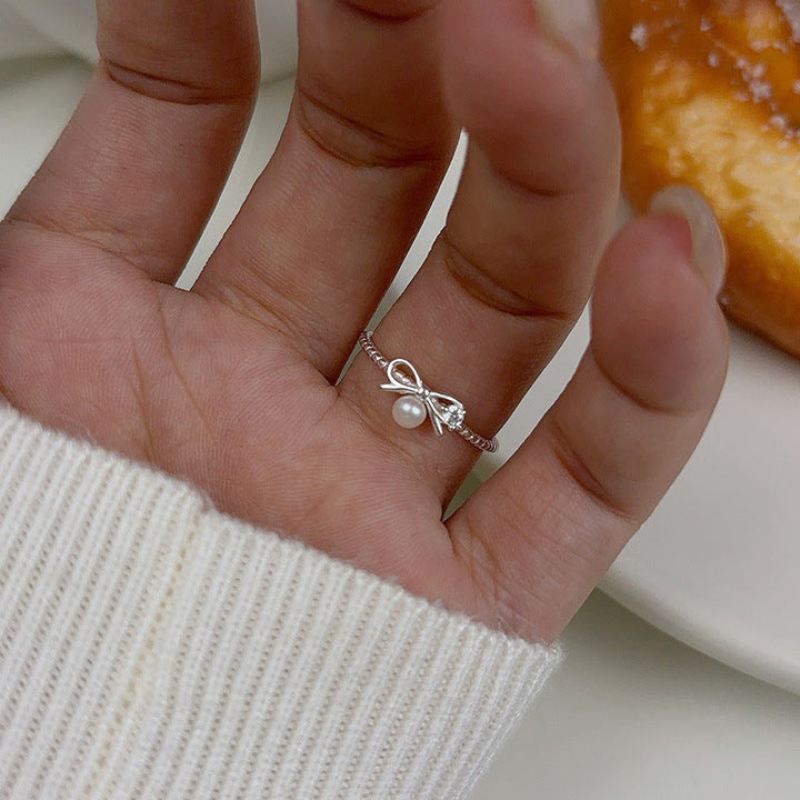 Women's ring with elegant bow and pearl motif Nin Boutique