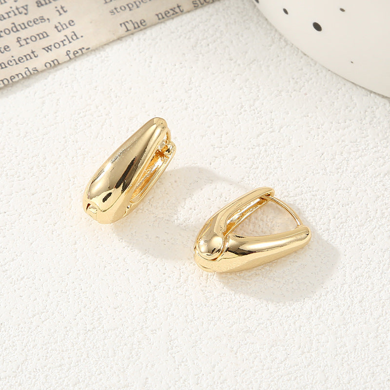 Women's earrings with elegant, curved design Nin Boutique