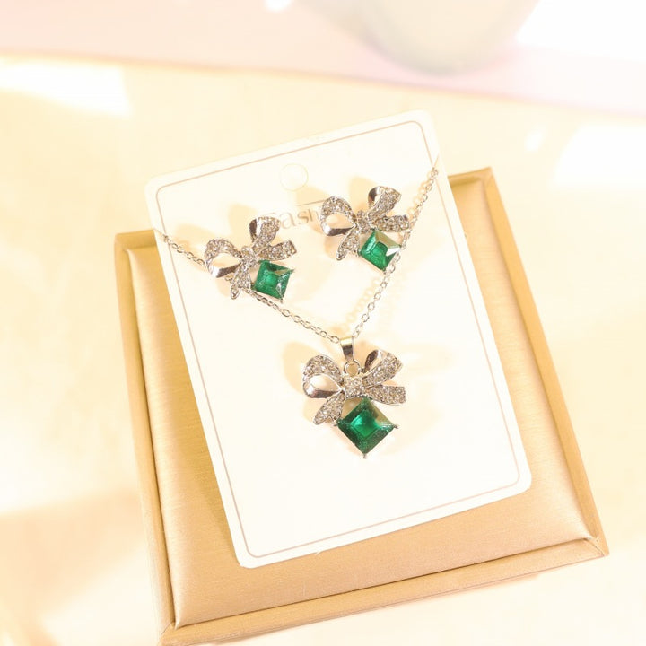 Women's vintage bow cocktail ring with square-cut gemstone simulant and pavé crystal accents Nin Boutique