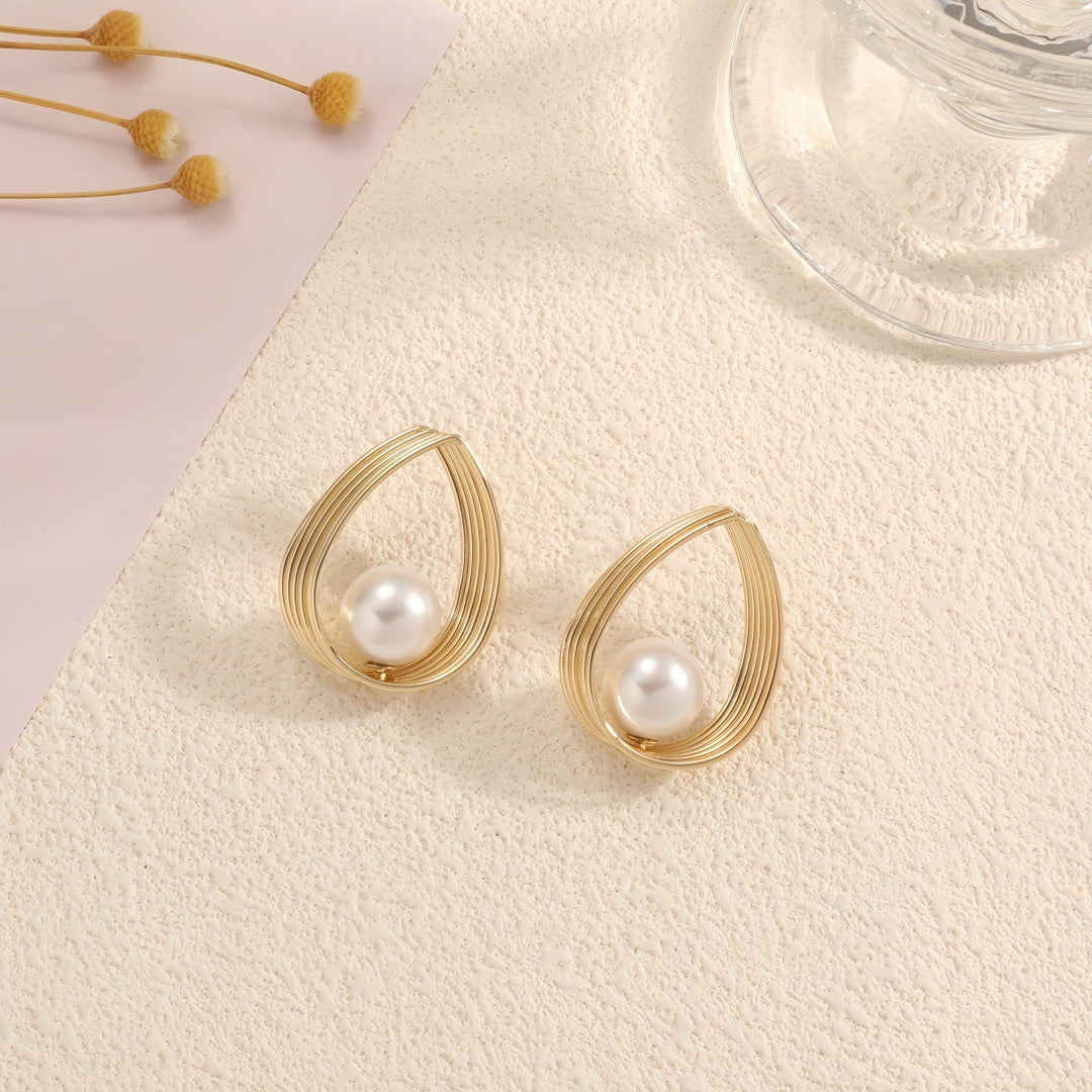 Women's earrings with elegant pearl and geometric shape Nin Boutique