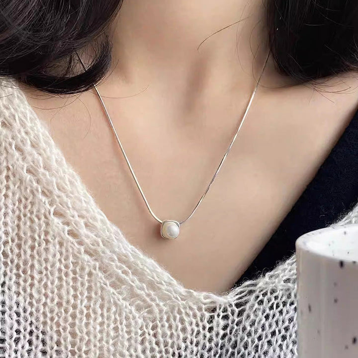 Women's necklace with timeless pearl pendant and elegant silver minimalism Nin Boutique