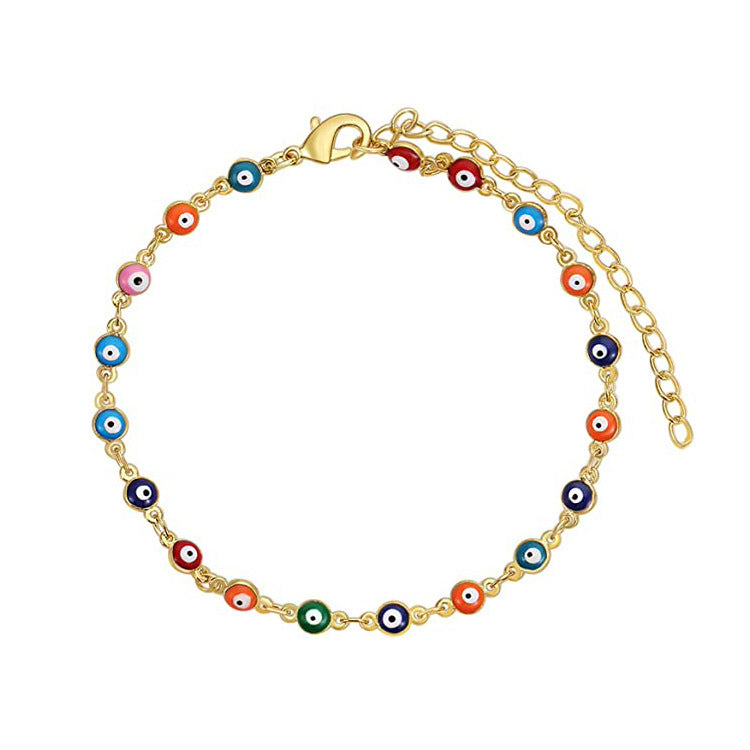Ladies playful ankle bracelet with colorful glass eyes and delicate design Nin Boutique