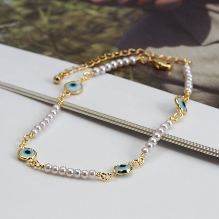 Women's ankle bracelet with protective eye and delicate pearl elements Nin Boutique