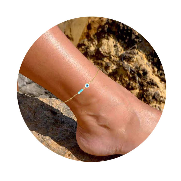 Ladies anklet with protective eye motif and colorful gemstone accents Nin Boutique