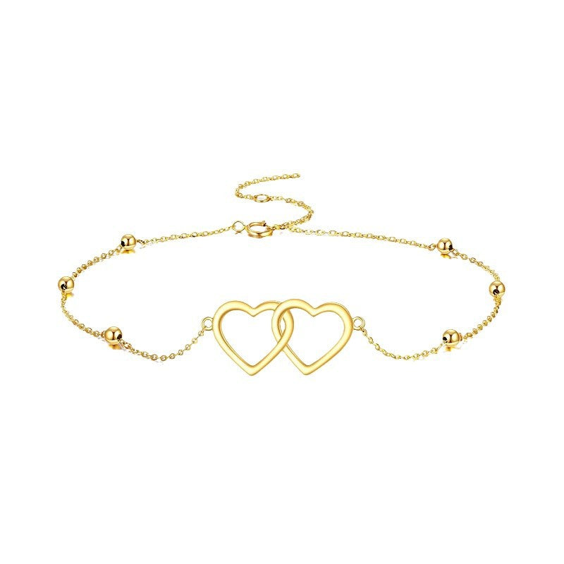 Ladies ankle bracelet with interlocking heart pendants and delicate design Nin Boutique