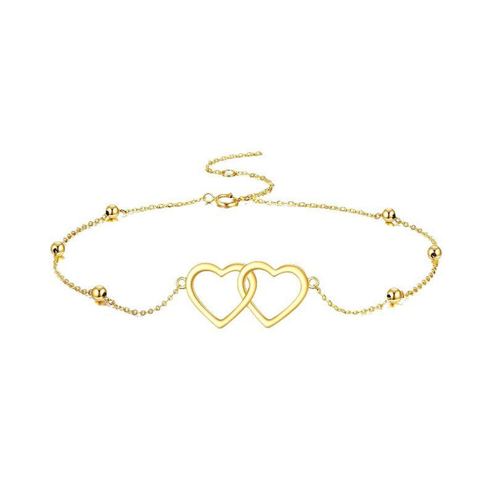 Ladies ankle bracelet with interlocking heart pendants and delicate design Nin Boutique