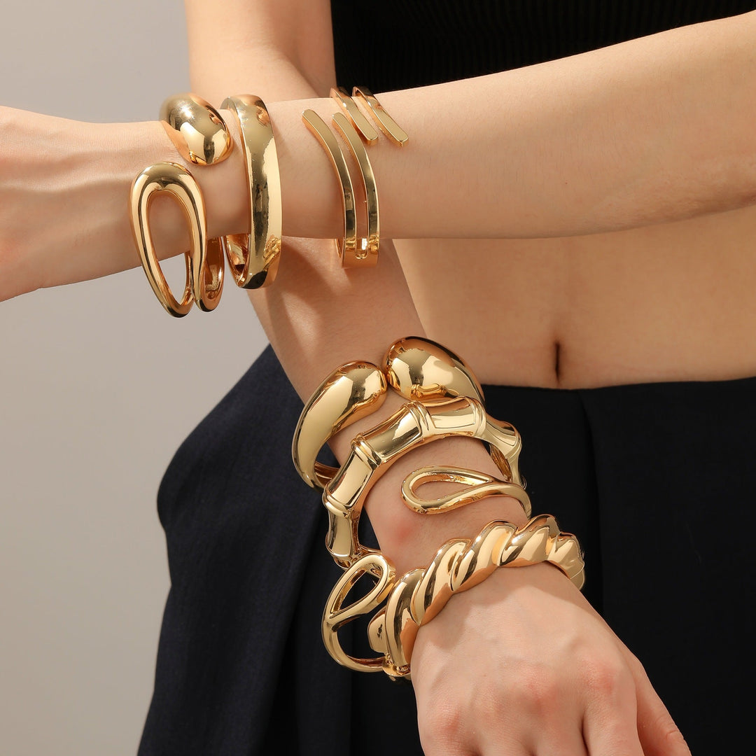 Women's arm cuff in modern, sculptural gold design Nin Boutique