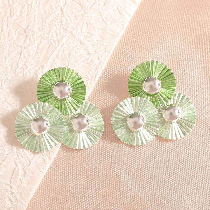 Ladies earrings with intricate fold design and shimmering accents Nin Boutique