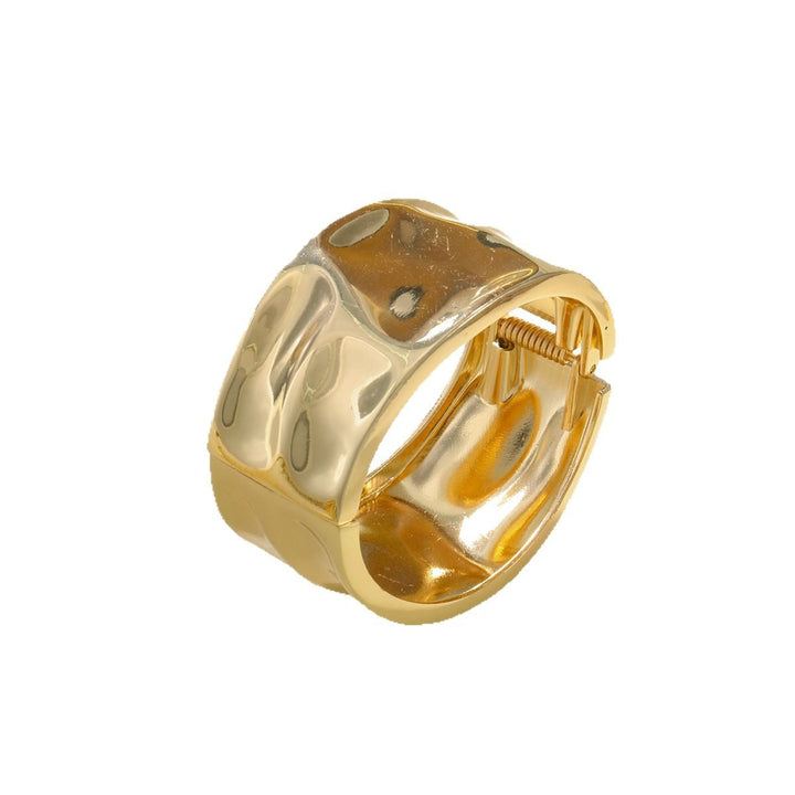 Women's arm cuff in modern, sculptural gold design Nin Boutique