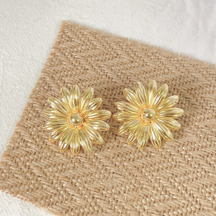 Ladies earrings in intricate flower design Nin Boutique