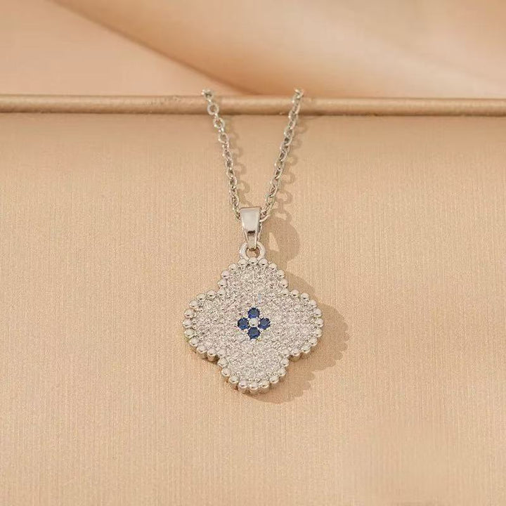 Women's intricate quatrefoil pave cubic zirconia pendant necklace with sapphire accent Nin Boutique