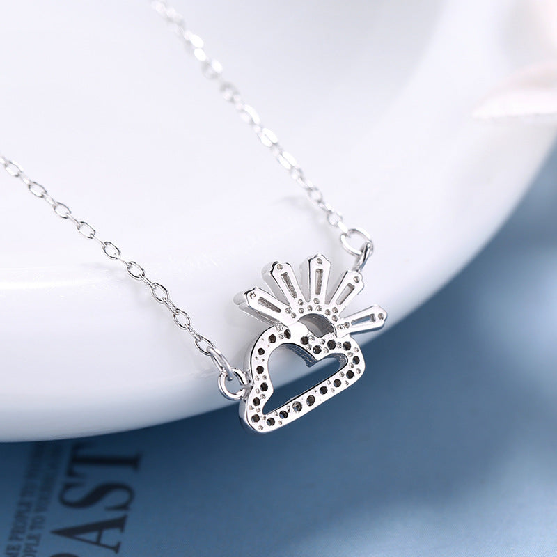 Ladies necklace in artistic cloud and sun design with sparkling zirconia from Nin Boutique