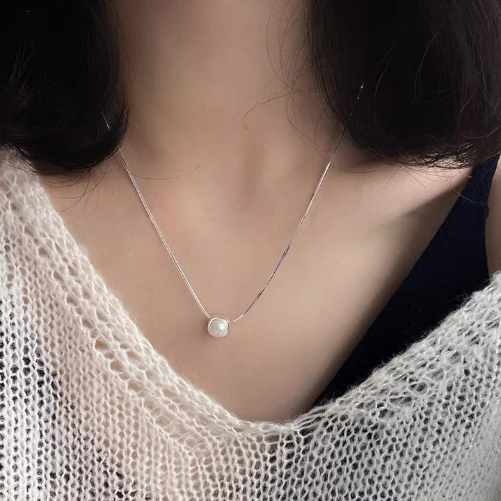 Women's necklace with timeless pearl pendant and elegant silver minimalism Nin Boutique