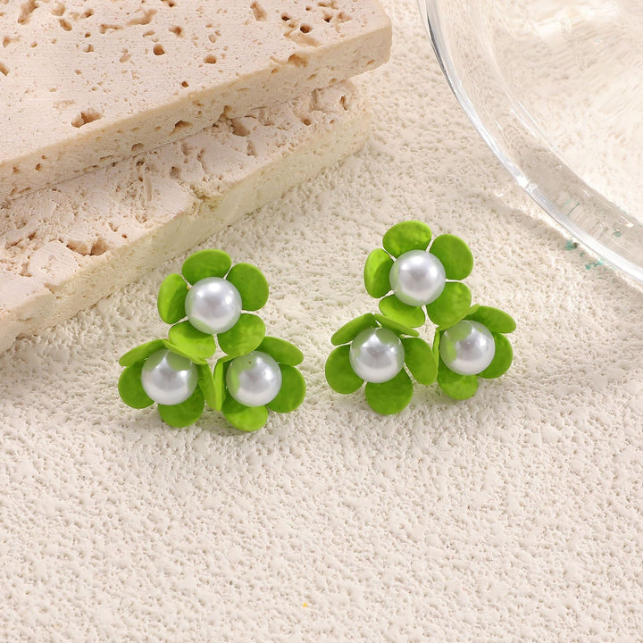 Ladies earrings with playful floral motif and pearl accent Nin Boutique