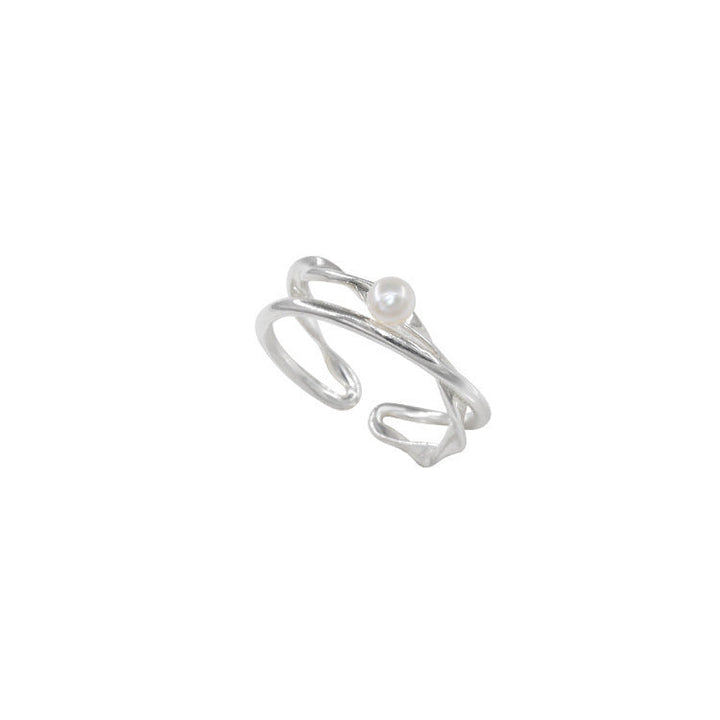 Ladies ring with elegant curved design and delicate pearl Nin Boutique