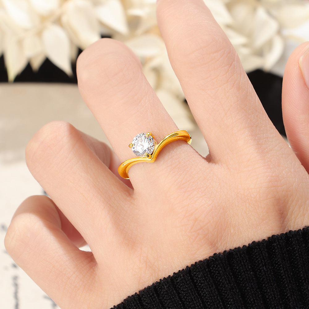 Ladies ring with elegant wave pattern and sparkling zirconia Nin Boutique