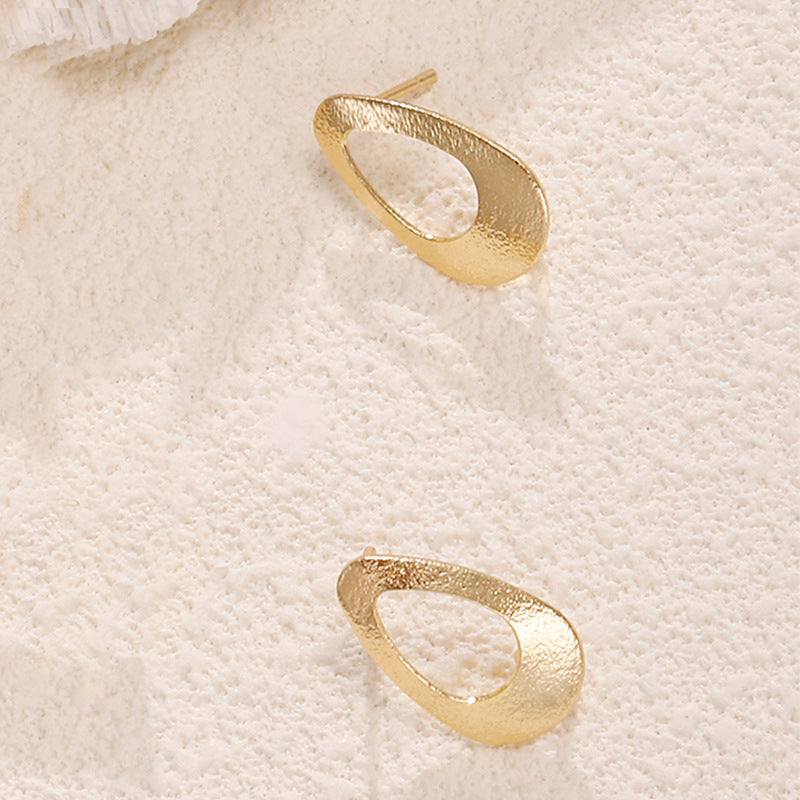 Ladies earrings in artistic face design Nin Boutique