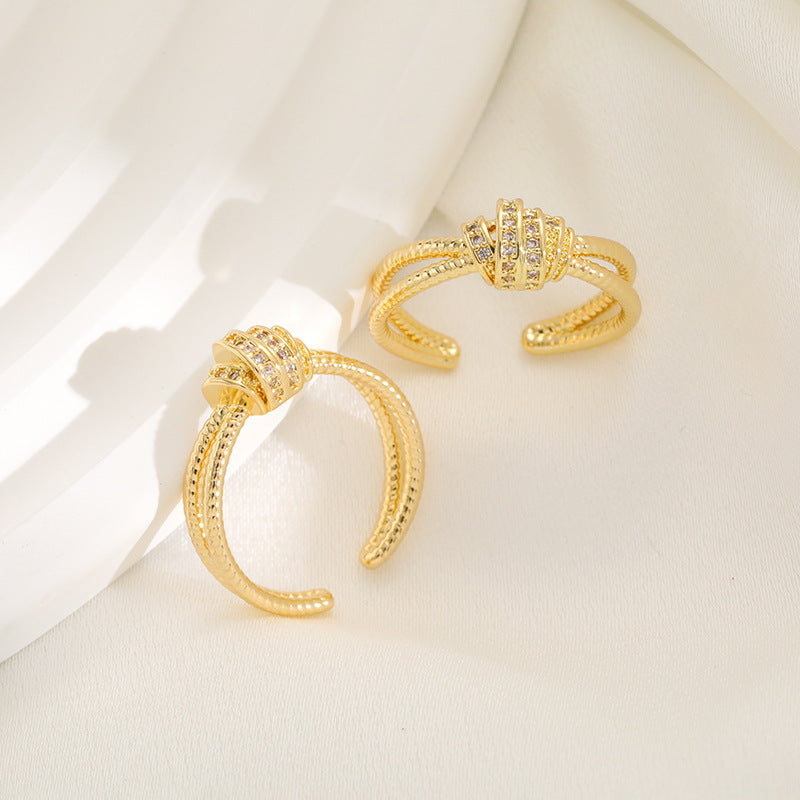 Ladies ring with elaborate, multi-layered design and zirconia appliqués Nin Boutique