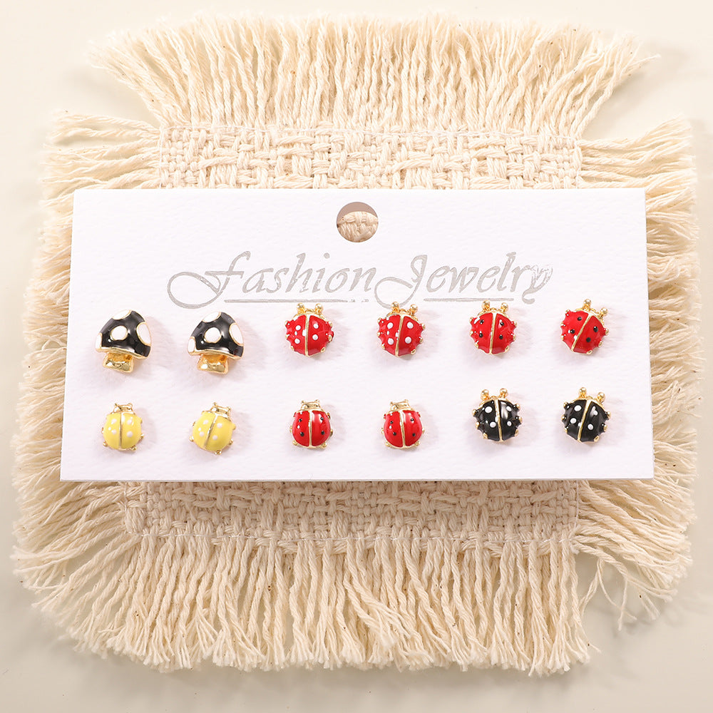 Ladies earring set with playful animal and mushroom design Nin Boutique