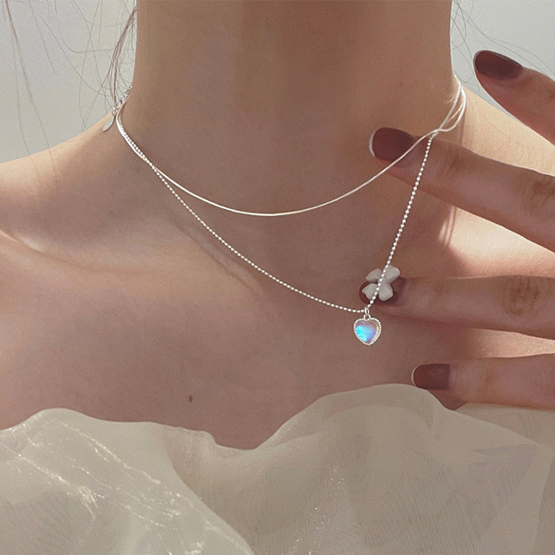 Women's necklace with playful heart pendant and floral detail Nin Boutique
