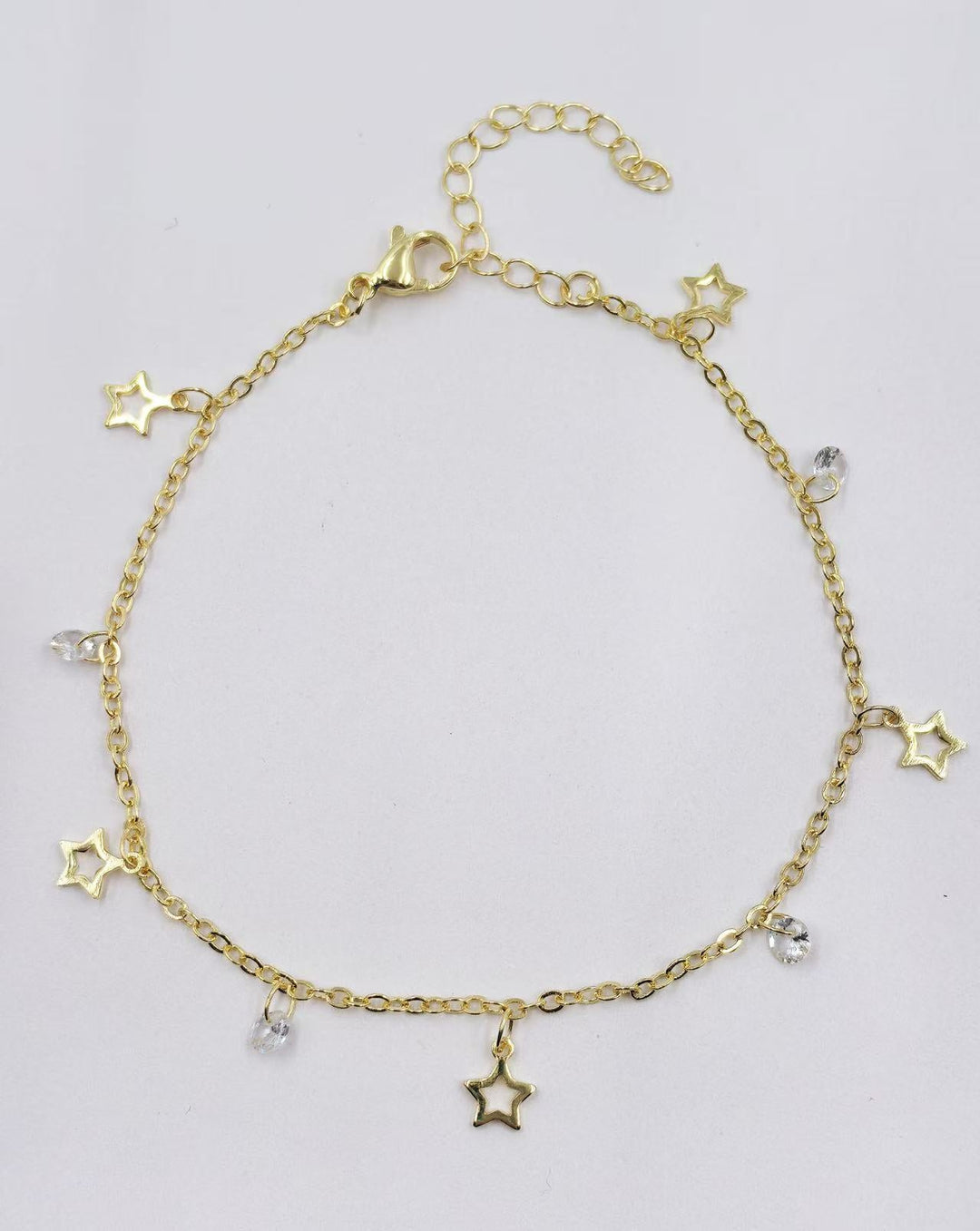 Ladies ankle bracelet with sparkling crystal pendants and delicate gold design Nin Boutique