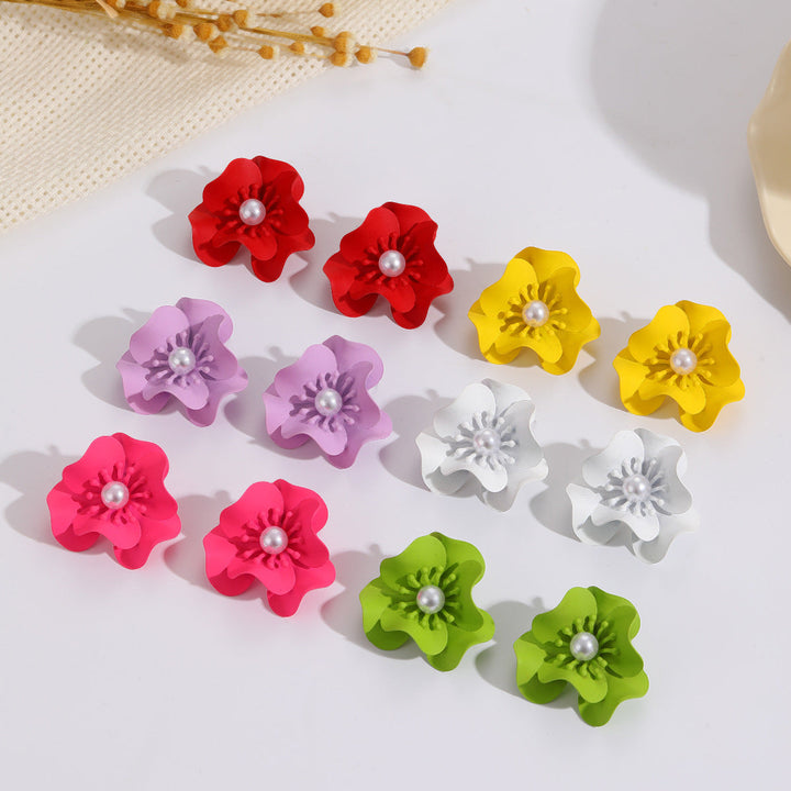 Women's earrings with intricate floral design and pearl accent Nin Boutique