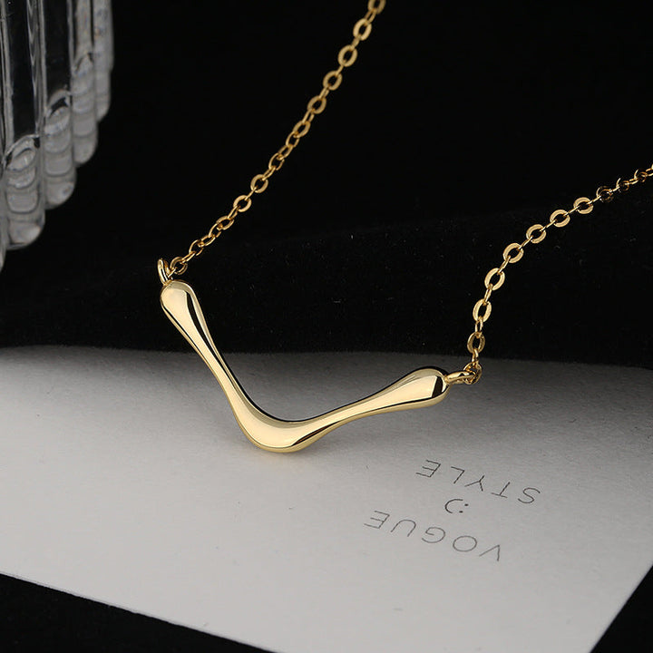 Women's necklace with modern, curved pendant Nin Boutique