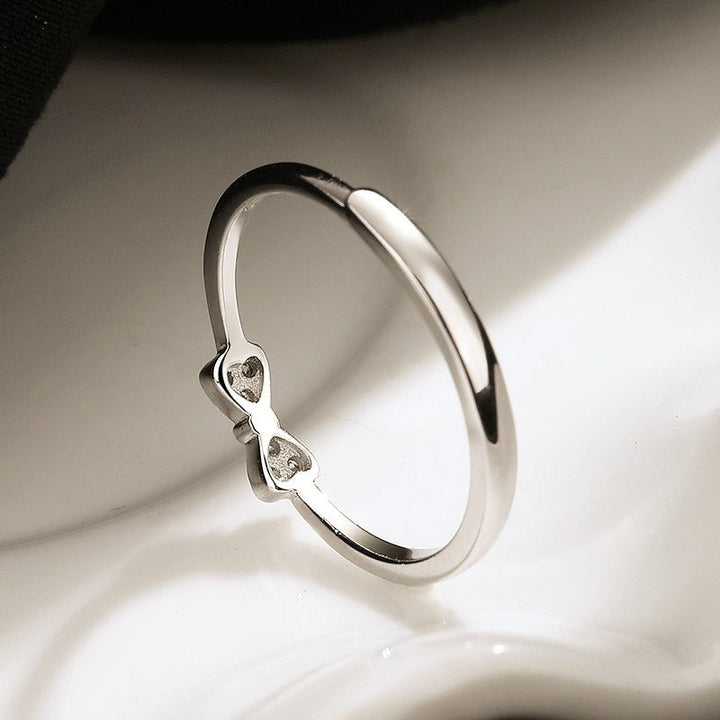 Women's ring with intricate bow motif and sparkling zirconia by Nin Boutique