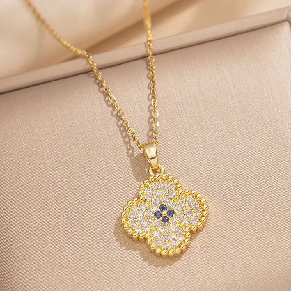 Women's intricate quatrefoil pave cubic zirconia pendant necklace with sapphire accent Nin Boutique