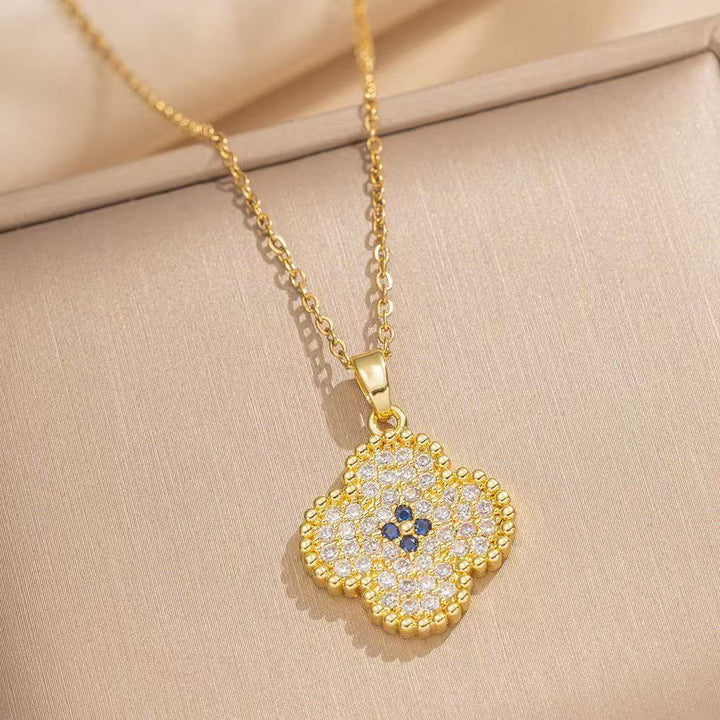Women's intricate quatrefoil pave cubic zirconia pendant necklace with sapphire accent Nin Boutique