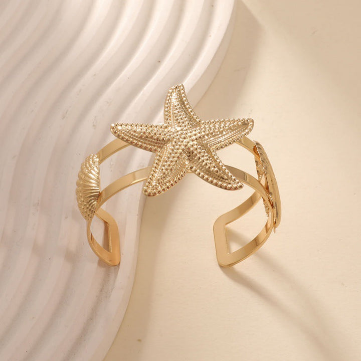 Women’s bracelet with intricate shell and starfish design Nin Boutique
