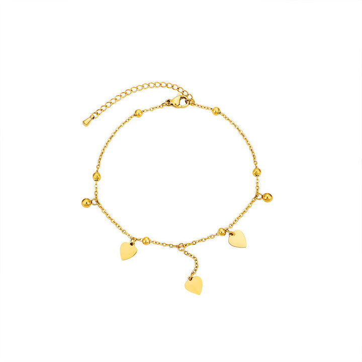 Ladies delicate ankle bracelet with heart-shaped pendants and shiny ball details Nin Boutique