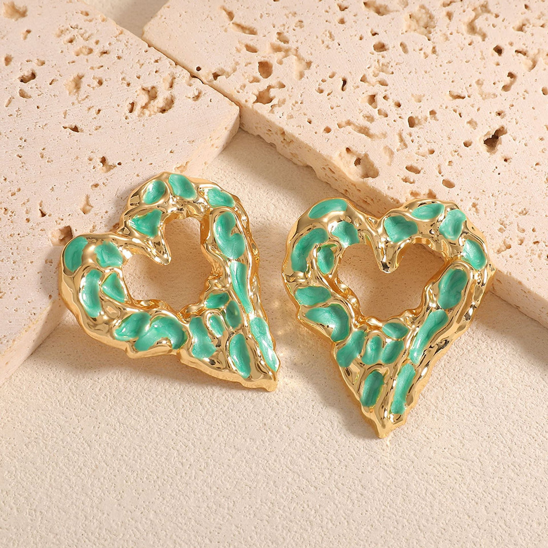 Women’s earrings with unique heart-shaped design and shimmering surface Nin Boutique