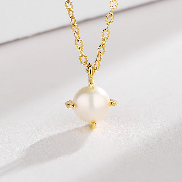 Women's necklace with elegant pearl design and fine gold pendant Nin Boutique