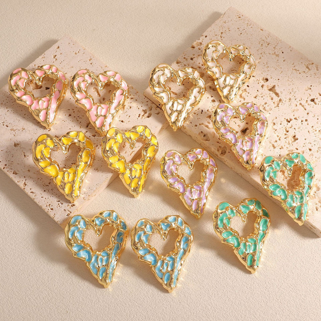 Women’s earrings with unique heart-shaped design and shimmering surface Nin Boutique