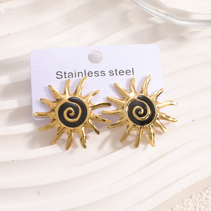 Ladies earrings in artistic sun motif Nin Boutique