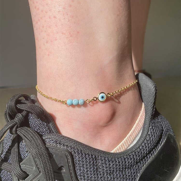 Ladies anklet with protective eye motif and colorful gemstone accents Nin Boutique
