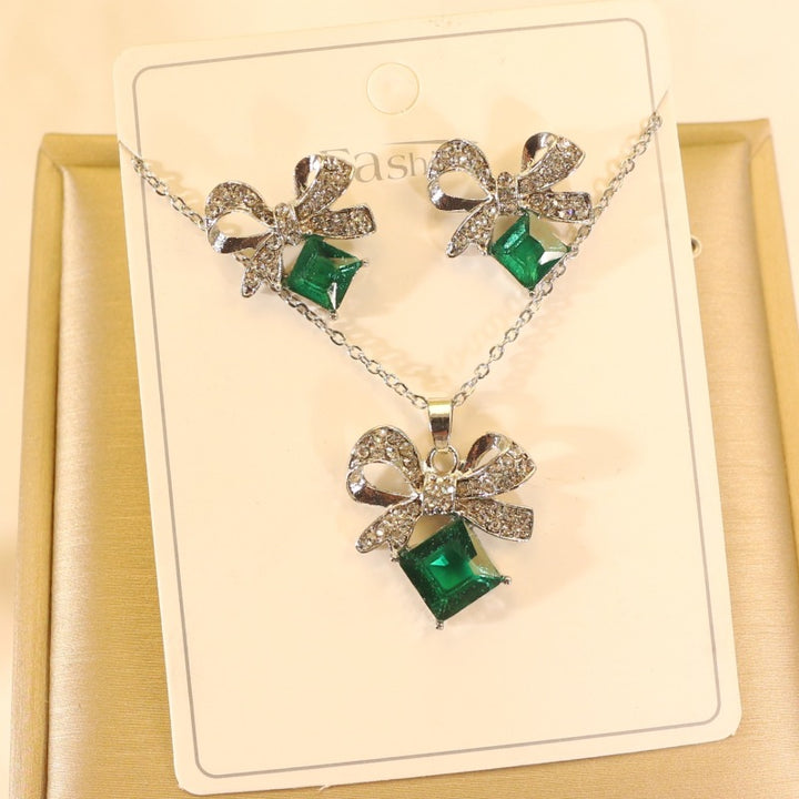Women's vintage bow cocktail ring with square-cut gemstone simulant and pavé crystal accents Nin Boutique