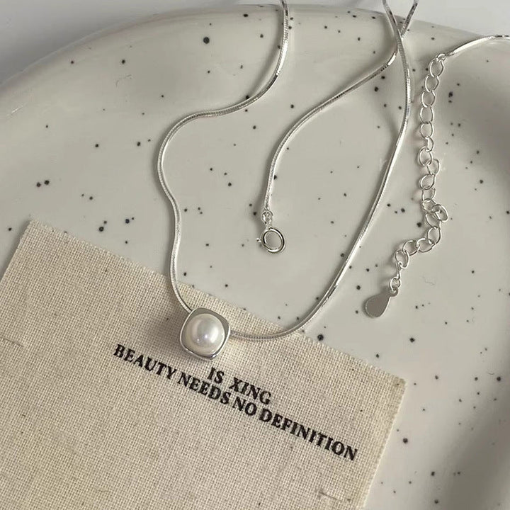 Women's necklace with timeless pearl pendant and elegant silver minimalism Nin Boutique