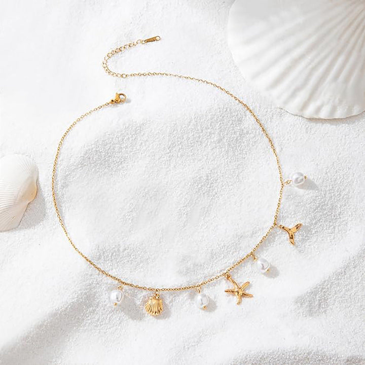 Women's necklace in maritime style with shells and pearl pendants Nin Boutique