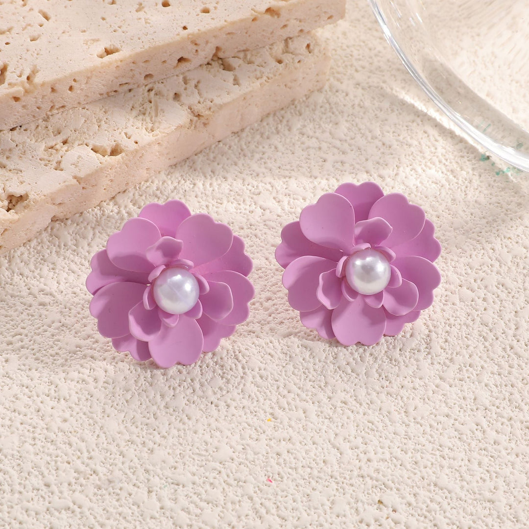 Ladies earrings in artistic floral style with pearl accent Nin Boutique