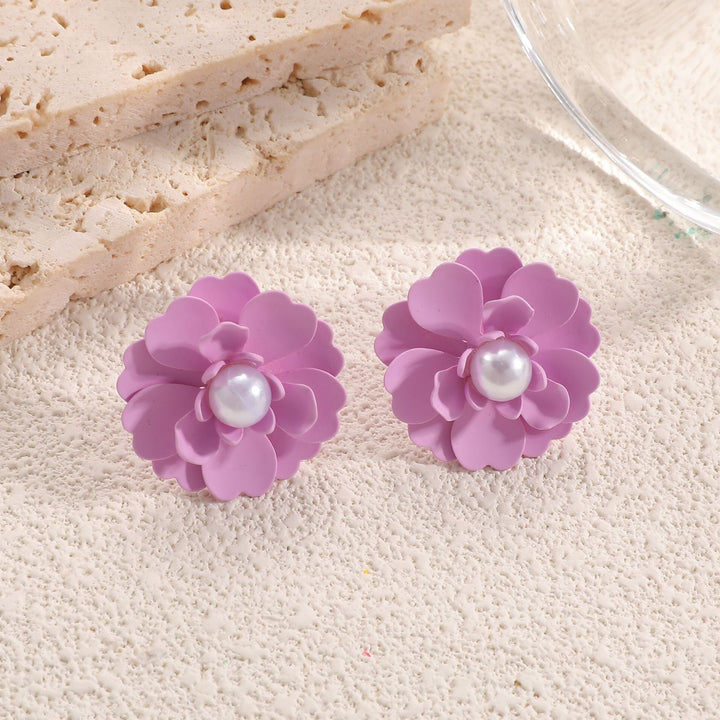 Ladies earrings in artistic floral style with pearl accent Nin Boutique