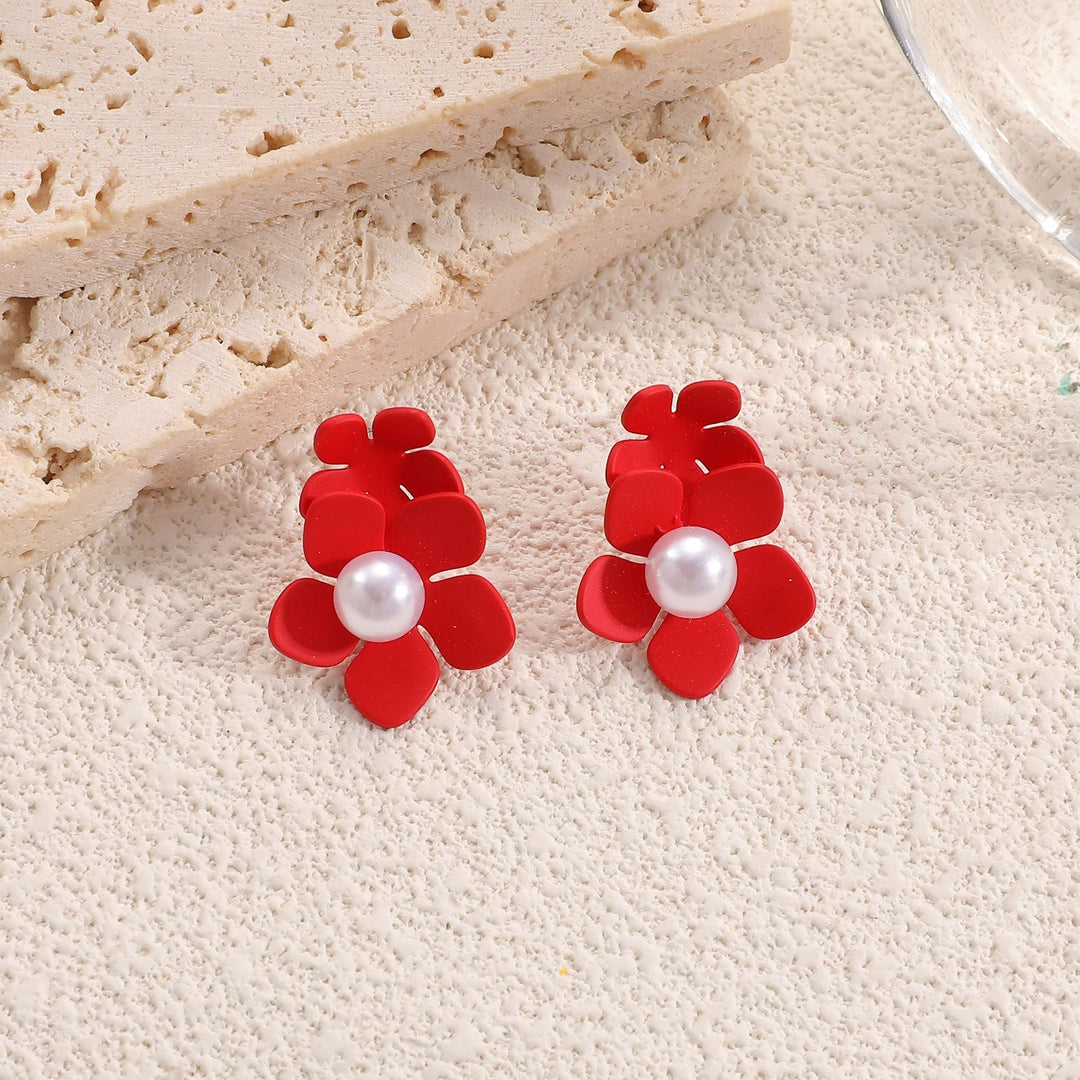 Ladies earrings with playful floral motif and pearl accent Nin Boutique