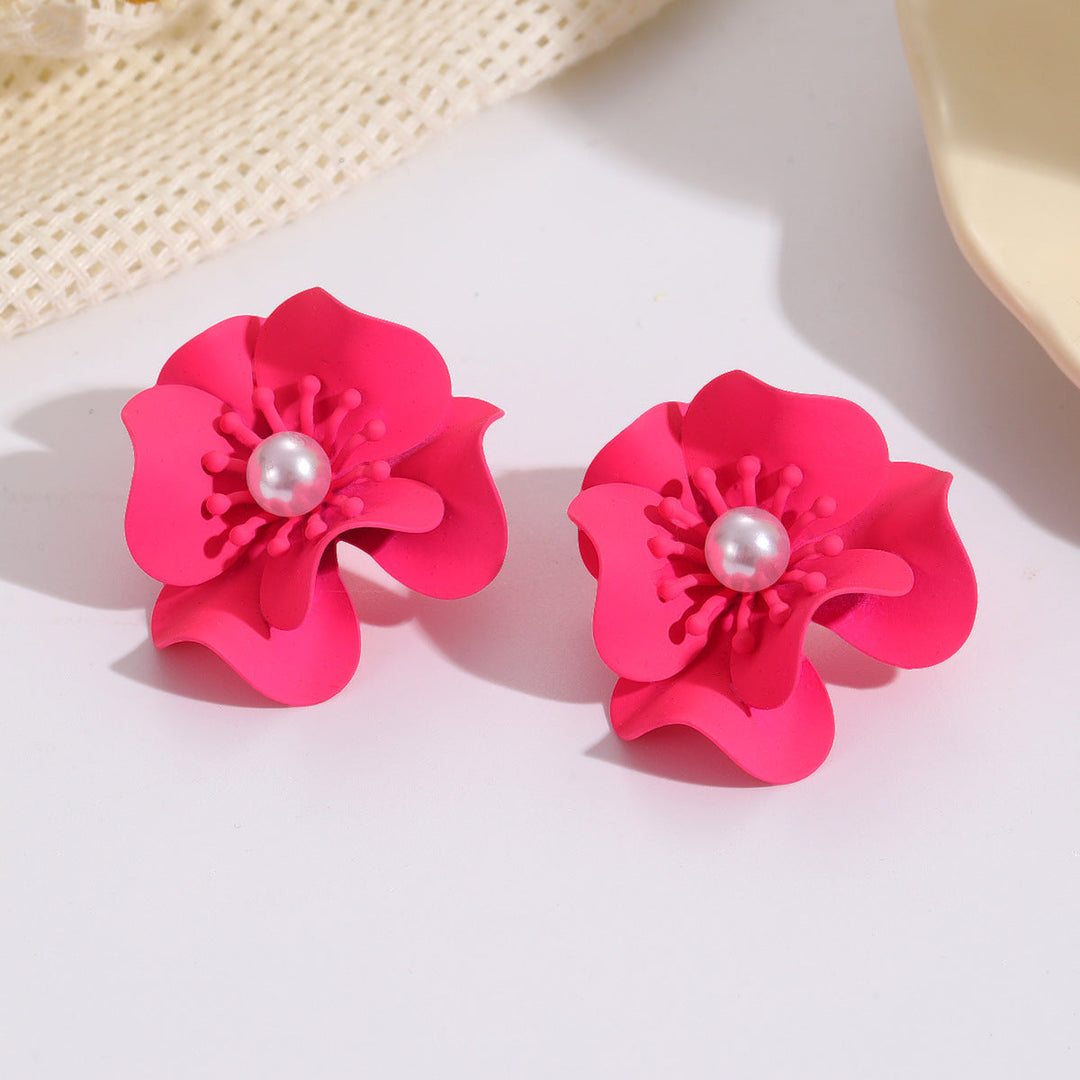 Women's earrings with intricate floral design and pearl accent Nin Boutique