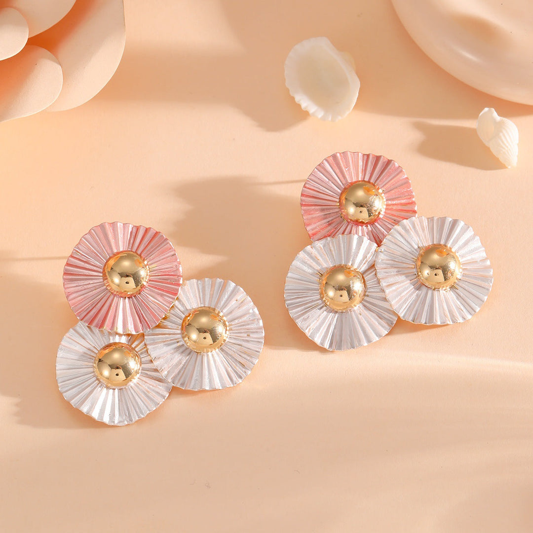 Ladies earrings with intricate fold design and shimmering accents Nin Boutique