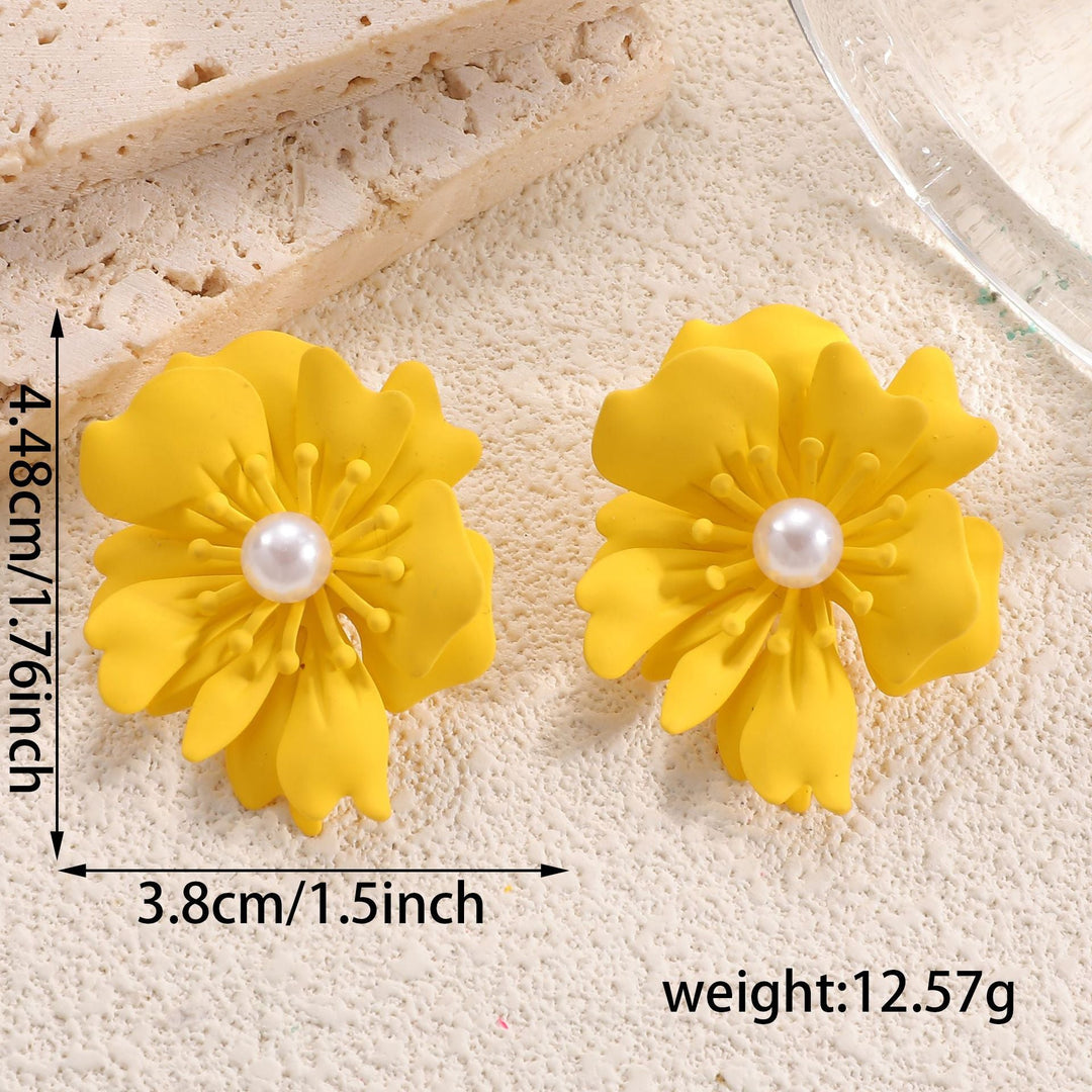 Ladies earrings with playful floral motif and pearl accent Nin Boutique